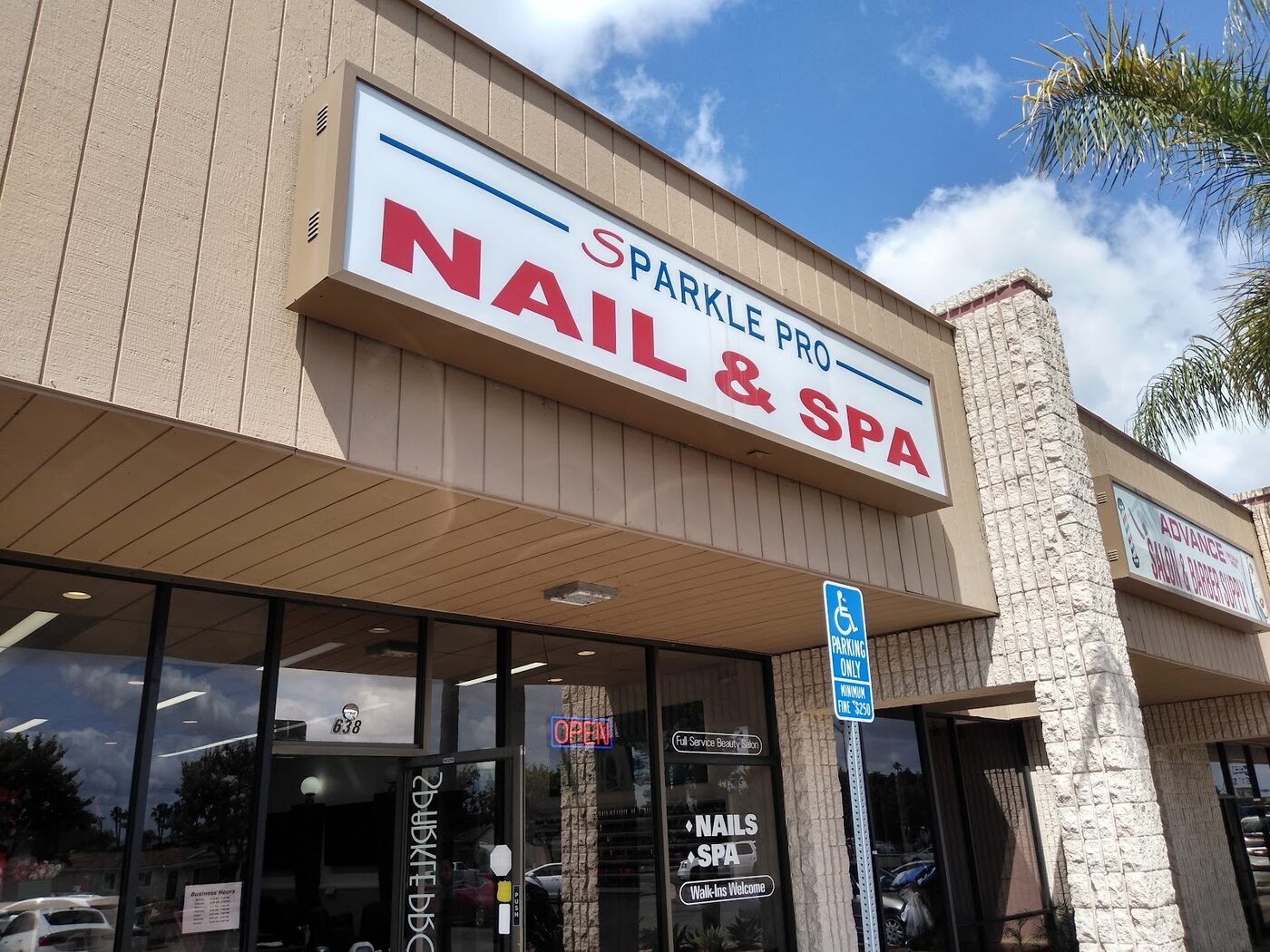 The Sparkle Pro Nail & Spa lightbox sign on the Jamacha Road frontage: NAIL & SPA in red capitals between two navy rules