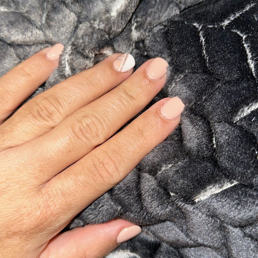 A white and nude set photographed on black