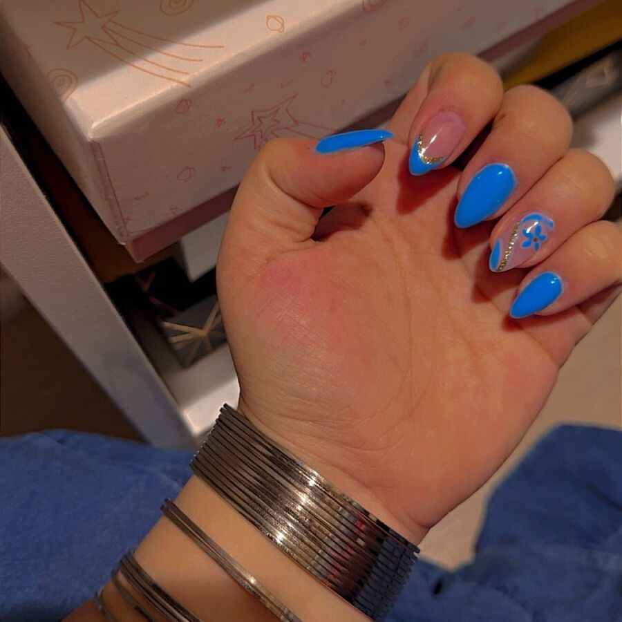 A bright blue set worn with gold bracelets